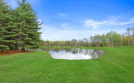 Take a Dip in our one-acre pond with Sandy Beach