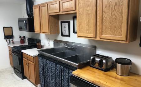 Kitchen with TWO Refrigerator/Freezers, a 5 burner Stove/Oven and Dishwasher